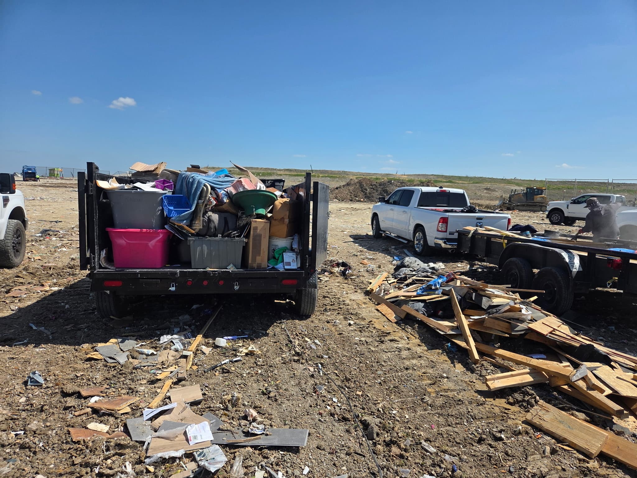 Dump trailer loaded with tubs and boxes from the Royse City storage unit, at the landfill