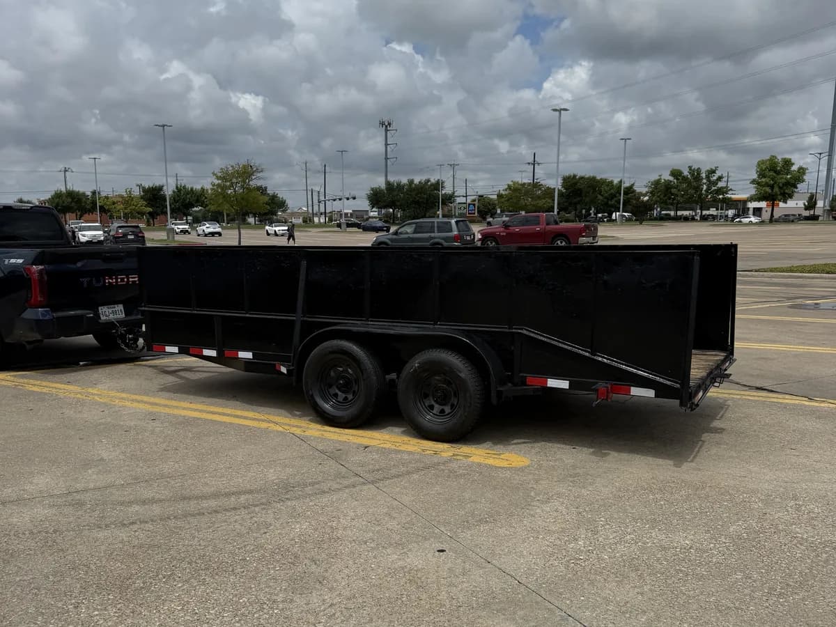 The Royse City Junk Removal Tundra hitched to its high-sided trailer